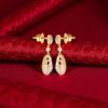 0.92 Cts Round Brilliant F/VS1 Diamonds Double Heart Dangle Earrings In 14K Gold