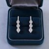 E-195 (4) 0.42 Carats Round Brilliant F/VS1 Diamonds Three-Stone Huggie Earrings 14K Gold