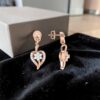 Classy 0.66 Cts Round Brilliant F/VS1 Diamonds Heart Dangle Earrings In 14K Gold