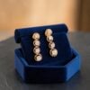 Exquisite 0.64 Cts Round Brilliant F/VS1 Diamonds Dangle Earrings 14K Rose Gold