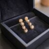 Exquisite 0.64 Cts Round Brilliant F/VS1 Diamonds Dangle Earrings 14K Rose Gold